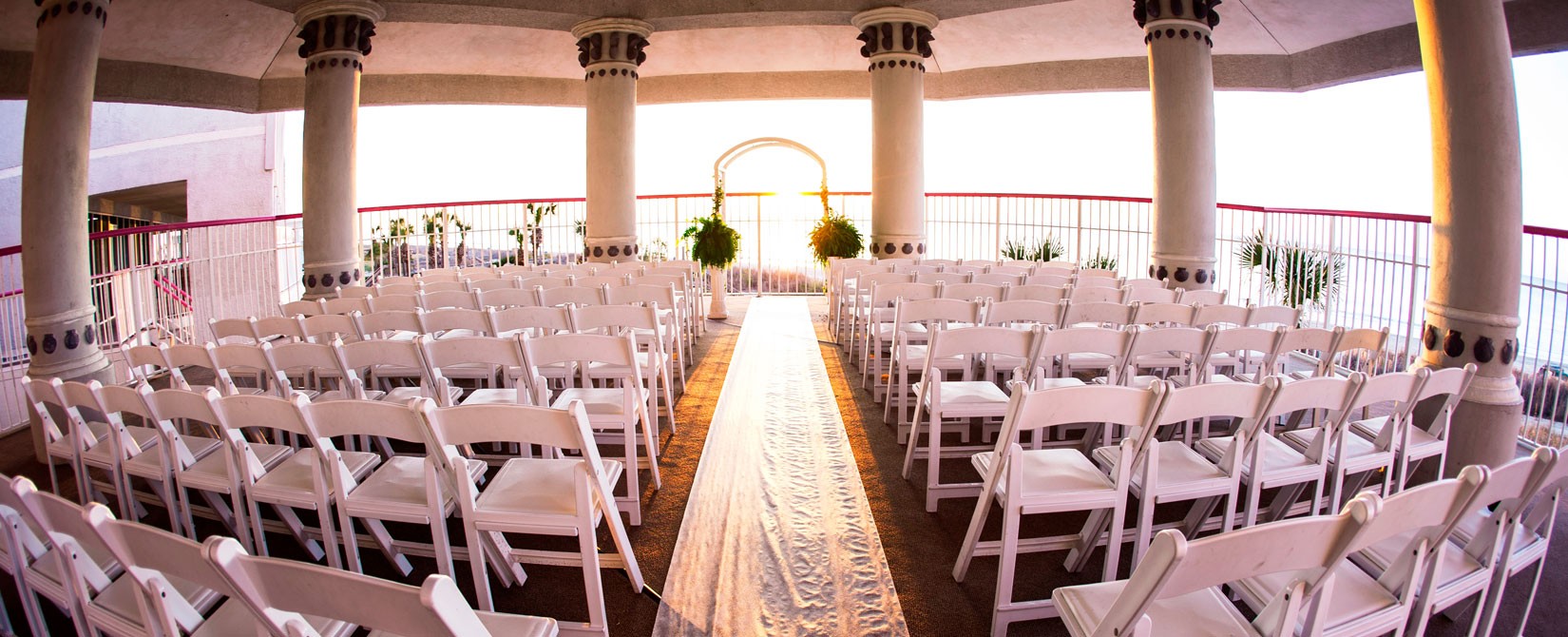 Wedding alter on outdoor patio overlooking the ocean at Crown Reef Resort