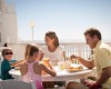 Family enjoying breakfast on the oceanfront patio at Sea Watch Myrtle Beach Resort