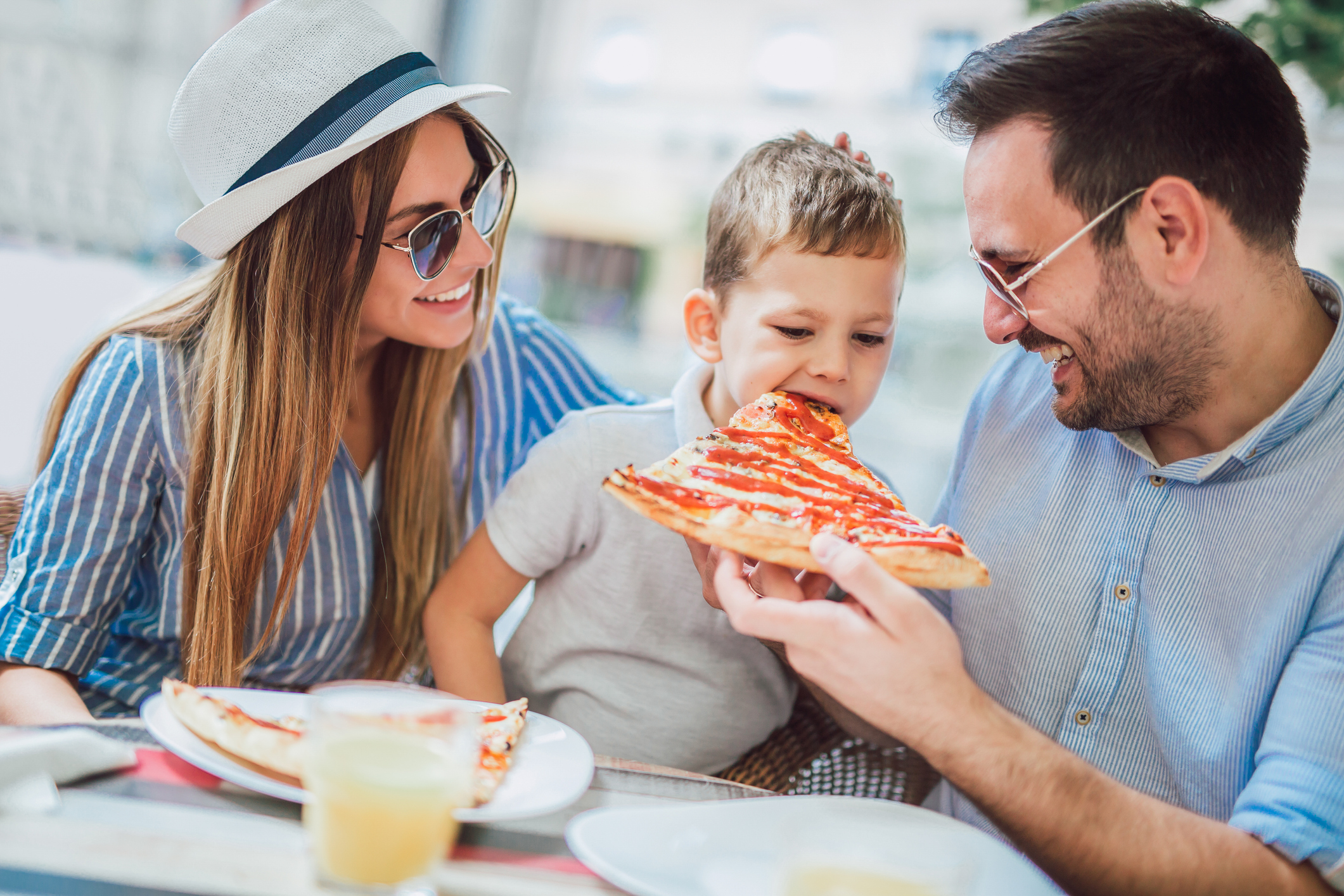 a family enjoying pizza