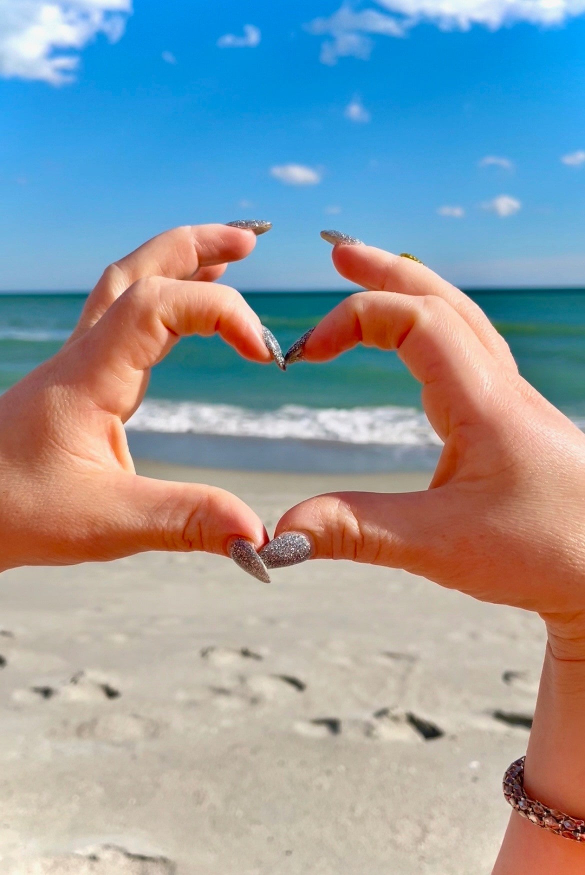 Heart hands on the beach