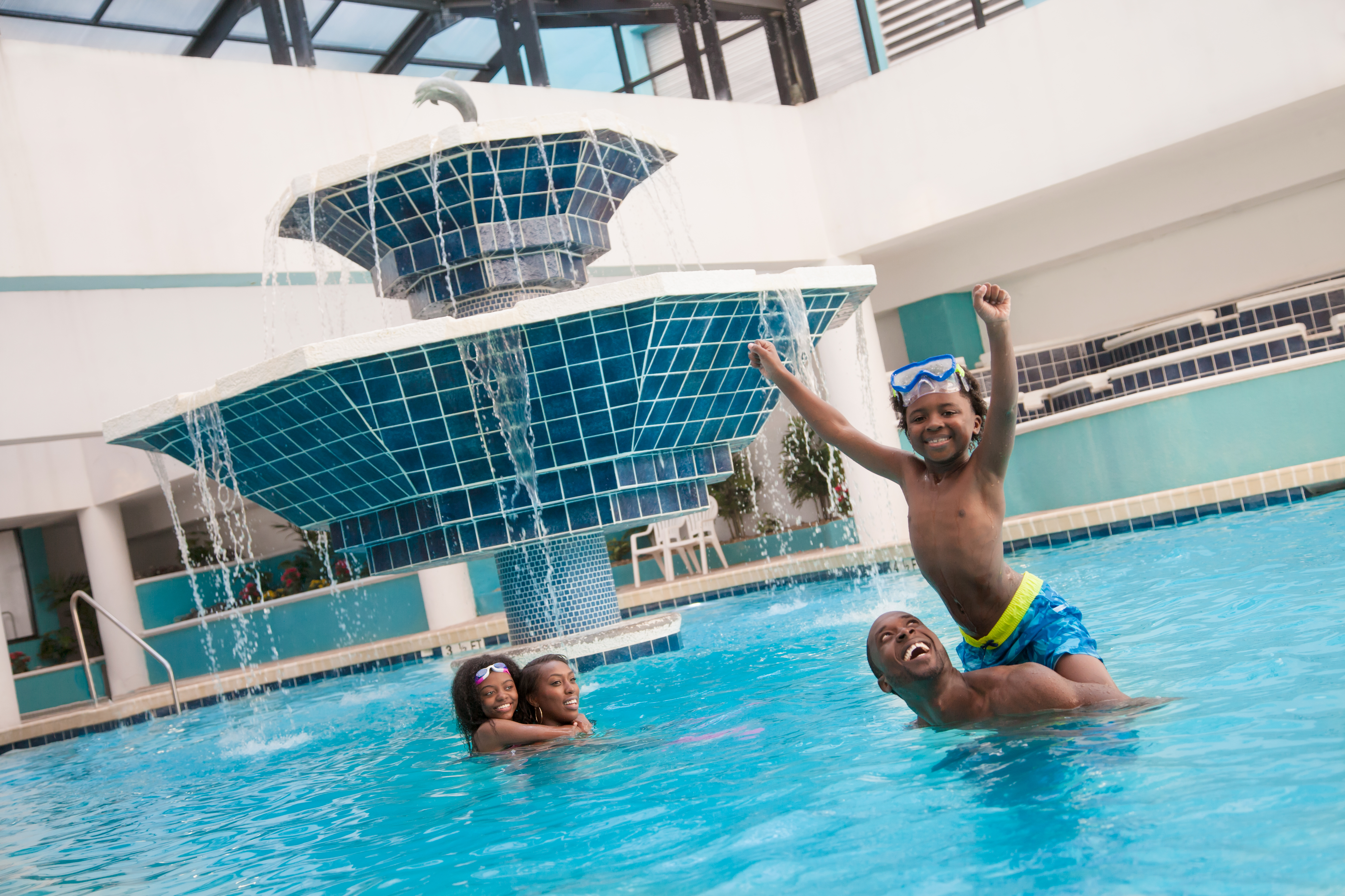 family playing in landmark resort's indoor pool facility