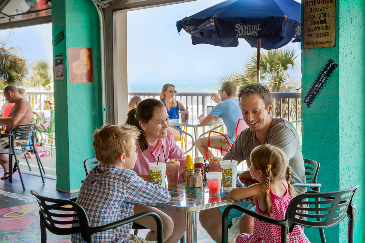 family enjoying waterfront dining