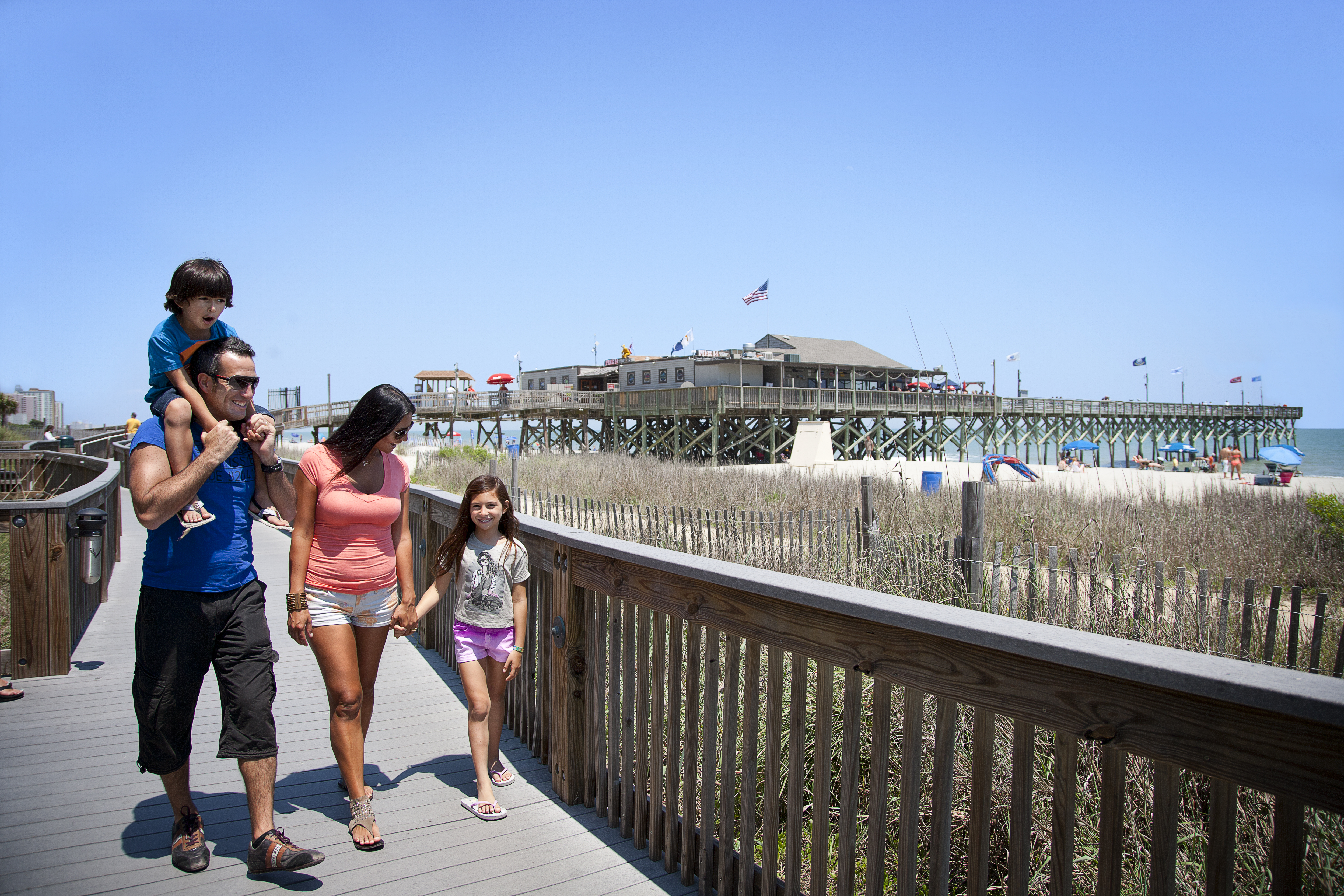 Family walking on the boardwalk Myrtle Beach