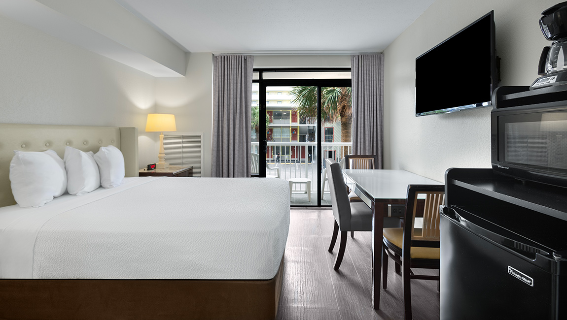 Room with one bed and TV